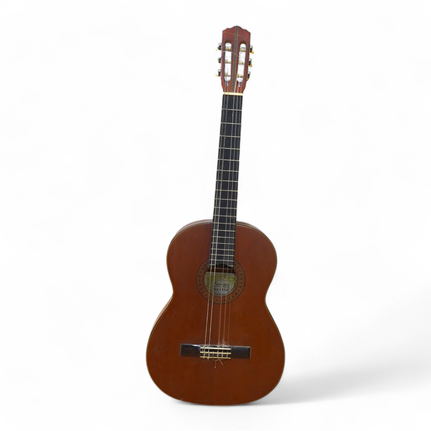 A Suzuki classical guitar, no.3067. Condition - fair, one string missing and scratches to the body.